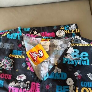 Women’s NWT scrub top-Peanuts inspired with many loved characters! Size L